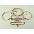A collection of gold jewellery comprising a 9ct gold five bar bracelet, a chain bracelet with padloc... 