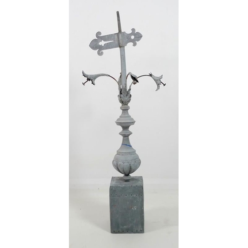 835 - A vintage weather vane finial, in fragment zinc and tin, urn shaped with four leaf flowers, on recta... 