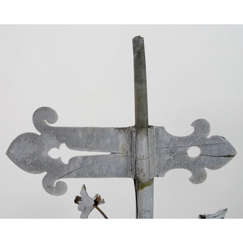 835 - A vintage weather vane finial, in fragment zinc and tin, urn shaped with four leaf flowers, on recta... 