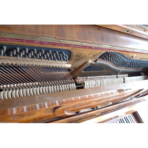 841 - A late 19th century German walnut upright piano, by Paul Klindworth, Berlin, the case richly decorat... 