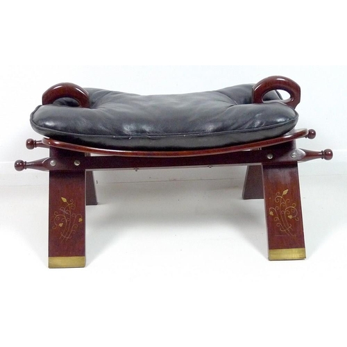 842 - A South East Asian hardwood camel saddle, with brass inlaid decoration and loose black leather seat ... 