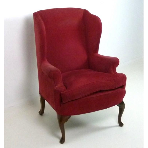 843 - A Duresta wing armchair, late 20th century, with short scroll arms and cabriole front legs, re-uphol... 