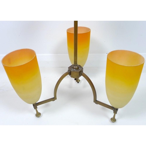 847 - An Art Deco brass hanging light, with three orange glass shades, 40 by 65cm high.