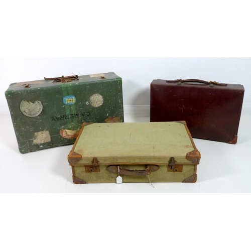 850 - A group of three vintage suitcases, comprising a tin suitcase, a leather case and a linen case with ... 