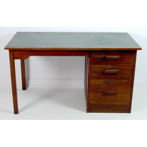 852 - A mid 20th century oak pedestal desk, with inset green surface, two shallow drawers and one filing d... 