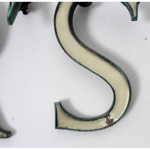 854 - A collection of enamel and bronze shop sign letters, early 20th century, cream enamel, 15cm. (27)