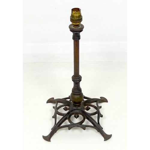 856 - A Benson cast iron table lamp, early 20th century, with fluted copper column and pierced base with s... 