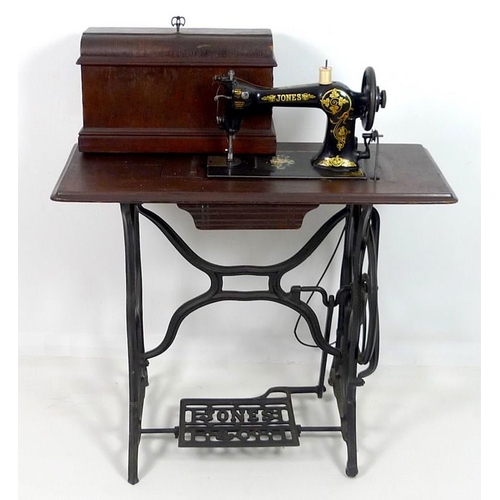 858 - An early 20th century Jones & Co sewing machine, decorated in black with gold painted highlights, on... 