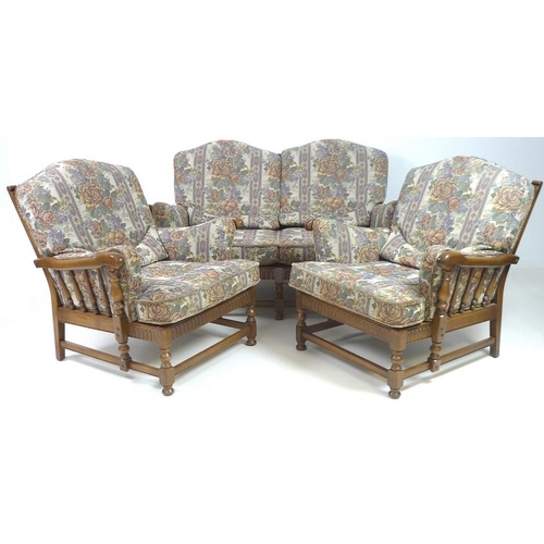 862 - An Ercol dark stained 'Old Colonial' three piece suite, comprising a two seater sofa, 160 by 95 by 9... 