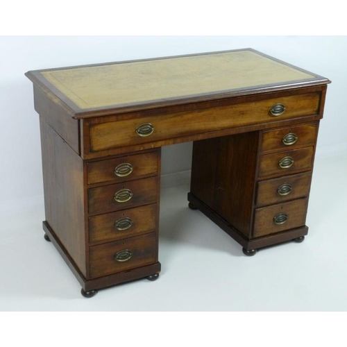 899 - A late 19th century mahogany twin pedestal desk, with beige tooled leather skiver, one wide drawer o... 