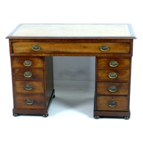 899 - A late 19th century mahogany twin pedestal desk, with beige tooled leather skiver, one wide drawer o... 