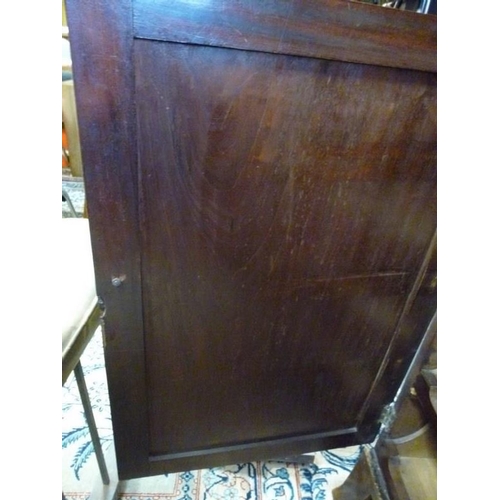 902 - A Regency mahogany and line inlaid linen press, the single drawer above two doors with oval line inl... 