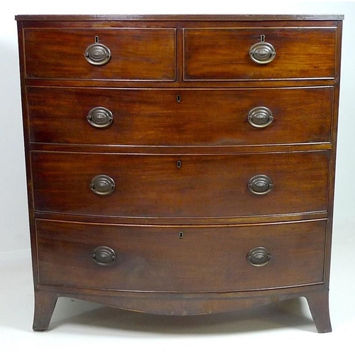 903 - A Regency mahogany chest of two short over three long graduating drawers, with cock beading and pres... 