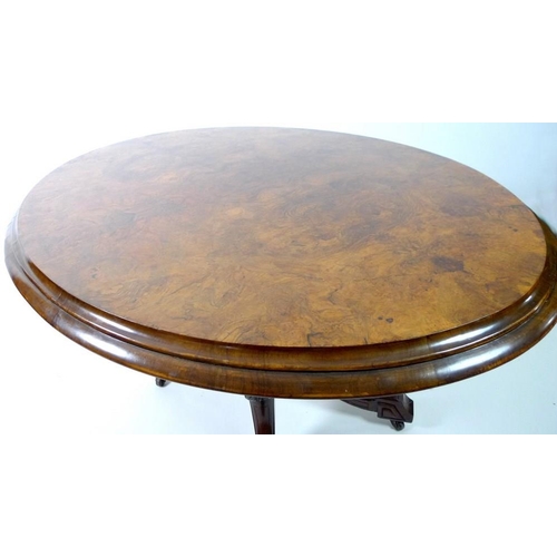 907 - A Victorian burr walnut loo table, with oval tilt top burr walnut surface, deeply moulded edge, rais... 