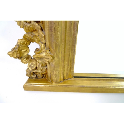 910 - A giltwood and composite overmantel mirror, late 18th century and later, in Rococo style frame with ... 