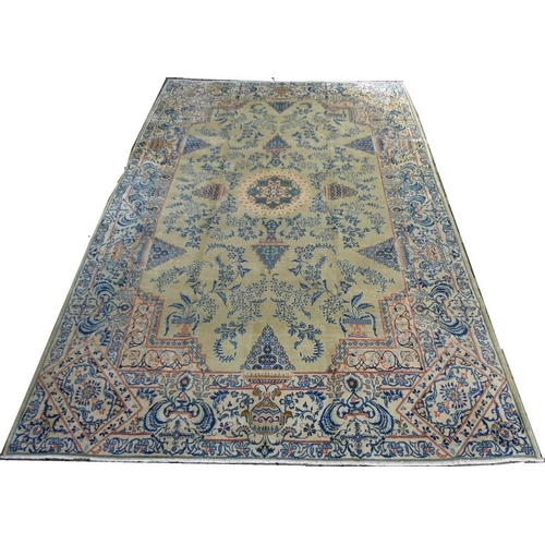 912 - A Kashan rug, blue delicate floral fronds and flower heads arranged in triangles on an unusual light... 