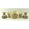A pair of Zsolnay Pecs ceramic reticulated vases, inkwell shaped, impressed to base 2743, 9cm, and a... 