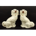 A pair of Staffordshire King Charles spaniels, 19th century, with gilt details, 33cm.