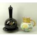 A Jackfield ceramic lidded bottle vase and plate, in black ground with enamel and gilt decoration, 3... 