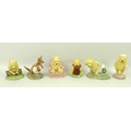 A collection of Royal Doulton Winnie the Pooh figurines, comprising Pooh and Piglet - The Windy Day,... 