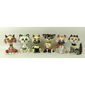 A group of six Lorna Bailey ceramic cats, each signed to the base, including a cat carrying a tin of... 