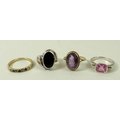 A group of rings, comprising a band set with four diamonds divided by three sapphires, size R, a rin... 