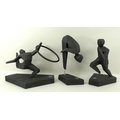 A group of three Royal Doulton London 2012 figures, comprising three black bisque ware stylised figu... 