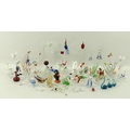 A collection of miniature glass blown animals, comprising birds on perches, swans, dogs, cats, eleph... 