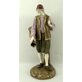 A Royal Worcester figure of Eastern Water Carrier, modelled by Hadley, green printed mark to base, a... 