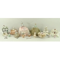 A collection of pincushion dolls, comprising five complete with cushions and a further six torsos an... 