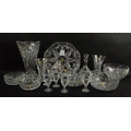 A group of cut glassware, comprising a vase, 33cm, two further vases, 18 and 20cm, a serving plate, ... 