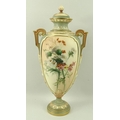 A Royal Worcester blush ivory twin handled vase and cover, of ovoid form, with pale green textured s... 