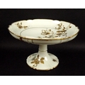 A Limoges part dessert service, in cream ground with autumnal floral decoration and gilt edges, stam... 