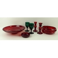 A Whitefriars ruby glass bowl, 20 by 8cm, a ruby glass dish, 28 by 7cm, a pair of candlesticks, 14cm... 