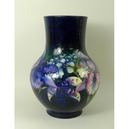 501 - A Moorcroft vase, of ovoid form with cylindrical neck, in the Iris pattern, signed to base in under ... 