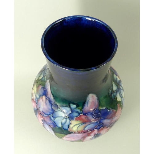 501 - A Moorcroft vase, of ovoid form with cylindrical neck, in the Iris pattern, signed to base in under ... 