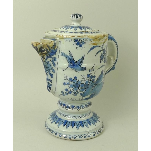 535 - A French faience tin glazed lidded chocolate pot, 18th century, decorated in underglaze blue with bi... 