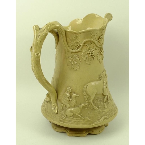 543 - A Victorian stoneware pitcher jug, by Cobridge, cast in relief with a hunting, the handle formed as ... 