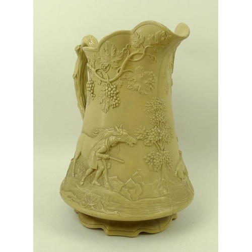 543 - A Victorian stoneware pitcher jug, by Cobridge, cast in relief with a hunting, the handle formed as ... 