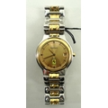 A Ferrari wristwatch, the gold coloured face wit baton numerals and date aperture, marked verso 2956... 