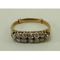 An Edwardian 18ct gold and diamond ring, twelve diamond arranged in five pairs with a diamond at eac... 