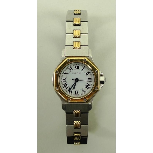 835 - A Cartier Santos lady's wristwatch, the circular white face with Roman numerals, with external hexag... 