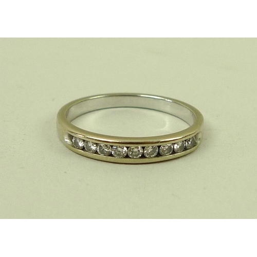 836 - A 14k gold and diamond half eternity ring, set with nine diamonds, size N, 2.3g.