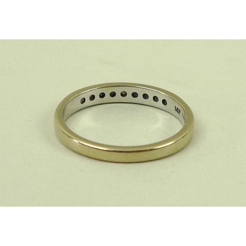 836 - A 14k gold and diamond half eternity ring, set with nine diamonds, size N, 2.3g.