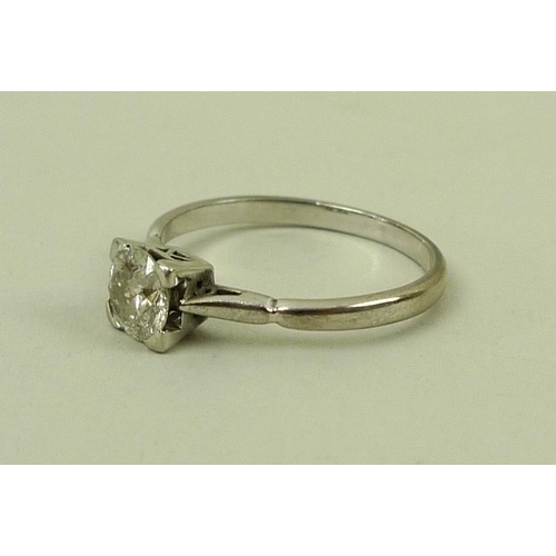 857 - An 18ct white gold diamond solitaire ring, the central round cut diamond 0.5ct, in four corner claw ... 