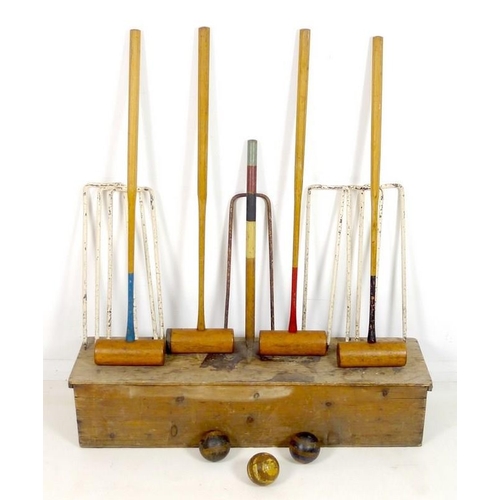 874 - A vintage Lillywhite lawn croquet set, No. 18 stencilled to the box, with four mallets, six white pa... 