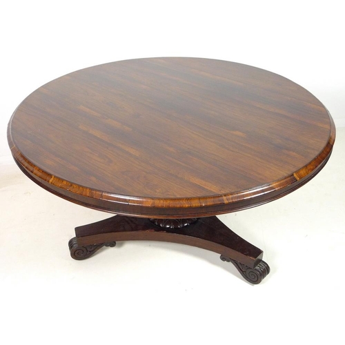 994 - A William IV rosewood breakfast table, the circular tilt top raised on a single pedestal with lappet... 