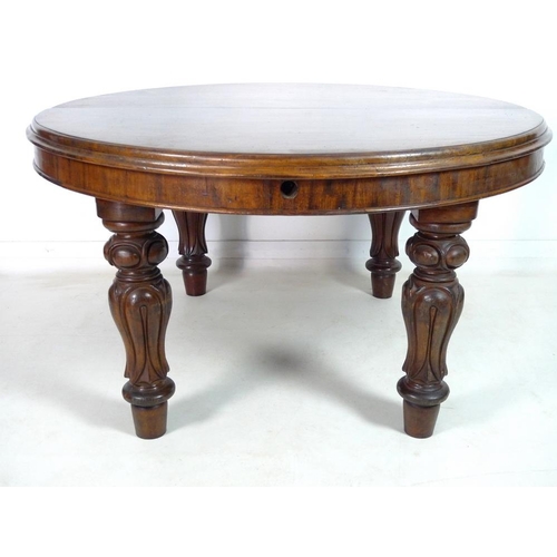 998 - An early Victorian mahogany extending dining table, the circular surface with moulded edge, raised o... 