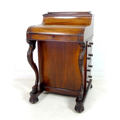 999 - A good Victorian rosewood Davenport desk, with pop up letter compartment, piano top shaped cover ope... 