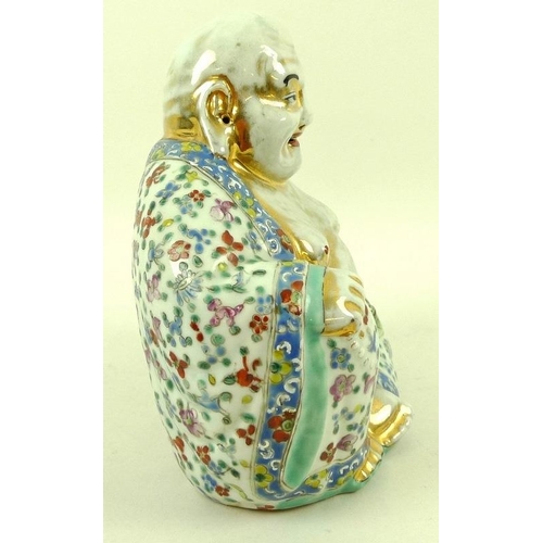 504 - An early 20th century Chinese Export porcelain figure, modelled as a seated laughing Buddha, hand pa... 